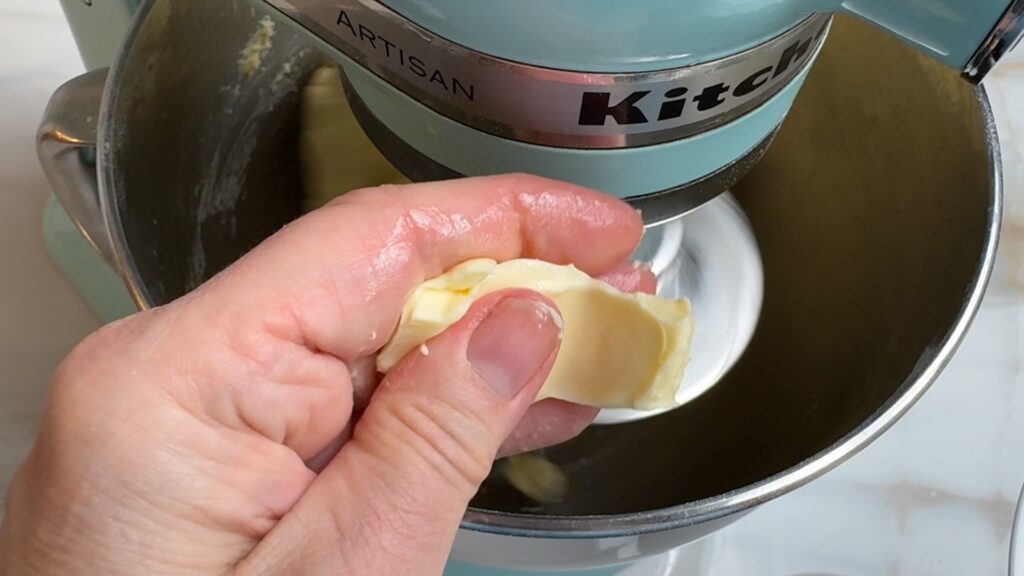 Butterstück Finger Zerdrücken